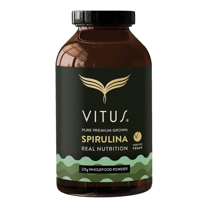 225g of Spirulina Powder in a brown glass supplement bottle on a white background.