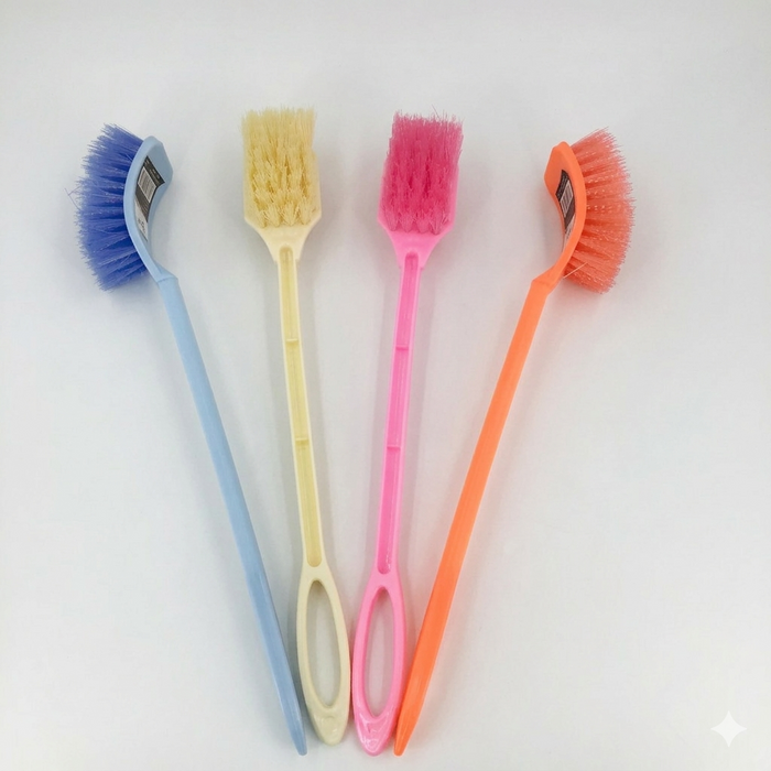 Four colorful cleaning brushes on a light gray background