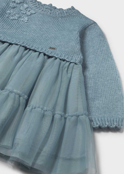 Closeup of Mayoral baby tulle dress showing applique detail, lined skirt, and soft Blue-Green fabric.