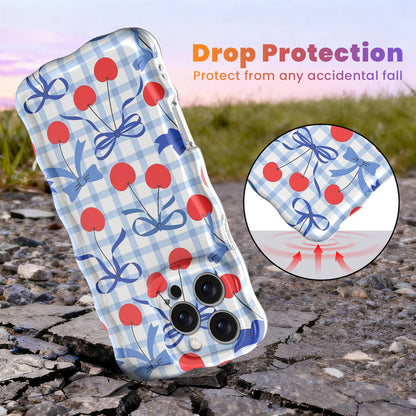 Blue and white gingham iPhone case featuring red cherries and blue ribbon bows with wavy edges.