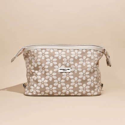 Beige expandable makeup bag with white floral pattern, Mocha Flower design by Coconut Lane.