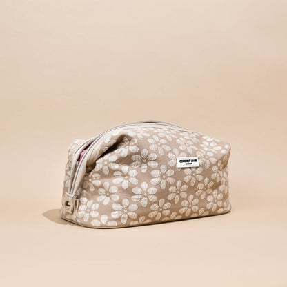 Expandable makeup bag with mocha brown floral pattern from Coconut Lane.