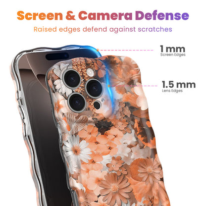 Fall Blooms Wavy Luxe MagSafe iPhone case with a warm autumn floral print in orange and cream from Fancy Bands