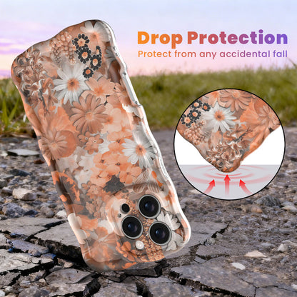 Fall Blooms Wavy Luxe MagSafe iPhone case with a warm autumn floral print in orange and cream from Fancy Bands