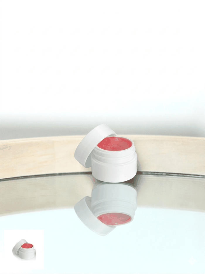 Jar of all-natural peppermint lip balm with moisturizing ingredients in clear container