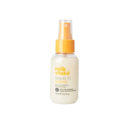 milk_shake  leave-in conditioner bottle with yellow cap on a white background