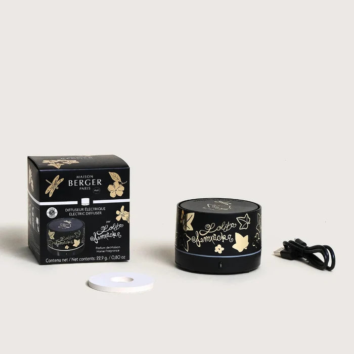 Black and gold diffuser with packaging on a white background