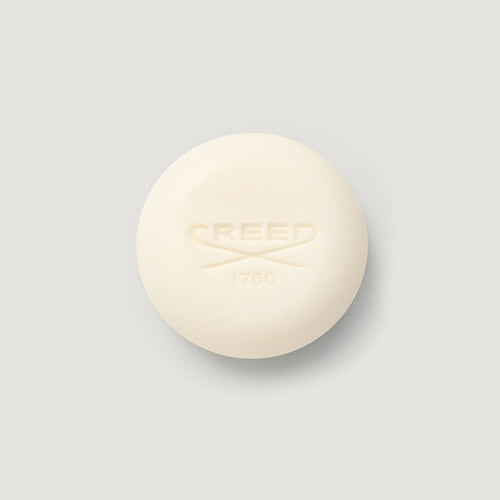 Cream-colored Carmina Perfumed Soap bar, embossed CREED 1760 logo, top view | Creed Boutique