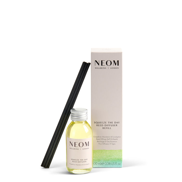 NEOM diffuser bottle and packaging on a white background