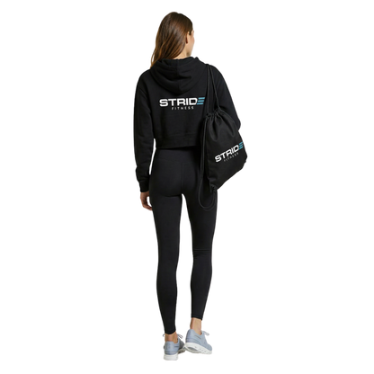 Black STRIDE Fitness drawstring gym bag designed for lightweight storage of workout gear, shoes, and daily essentials