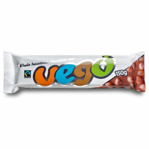 A packaged whole hazelnut chocolate bar from the brand Vego, shown horizontally on a plain white background. The wrapper is primarily white with a large, colorful 'vego' logo in orange, blue, brown, and green, and a photo of whole hazelnuts on the right side.